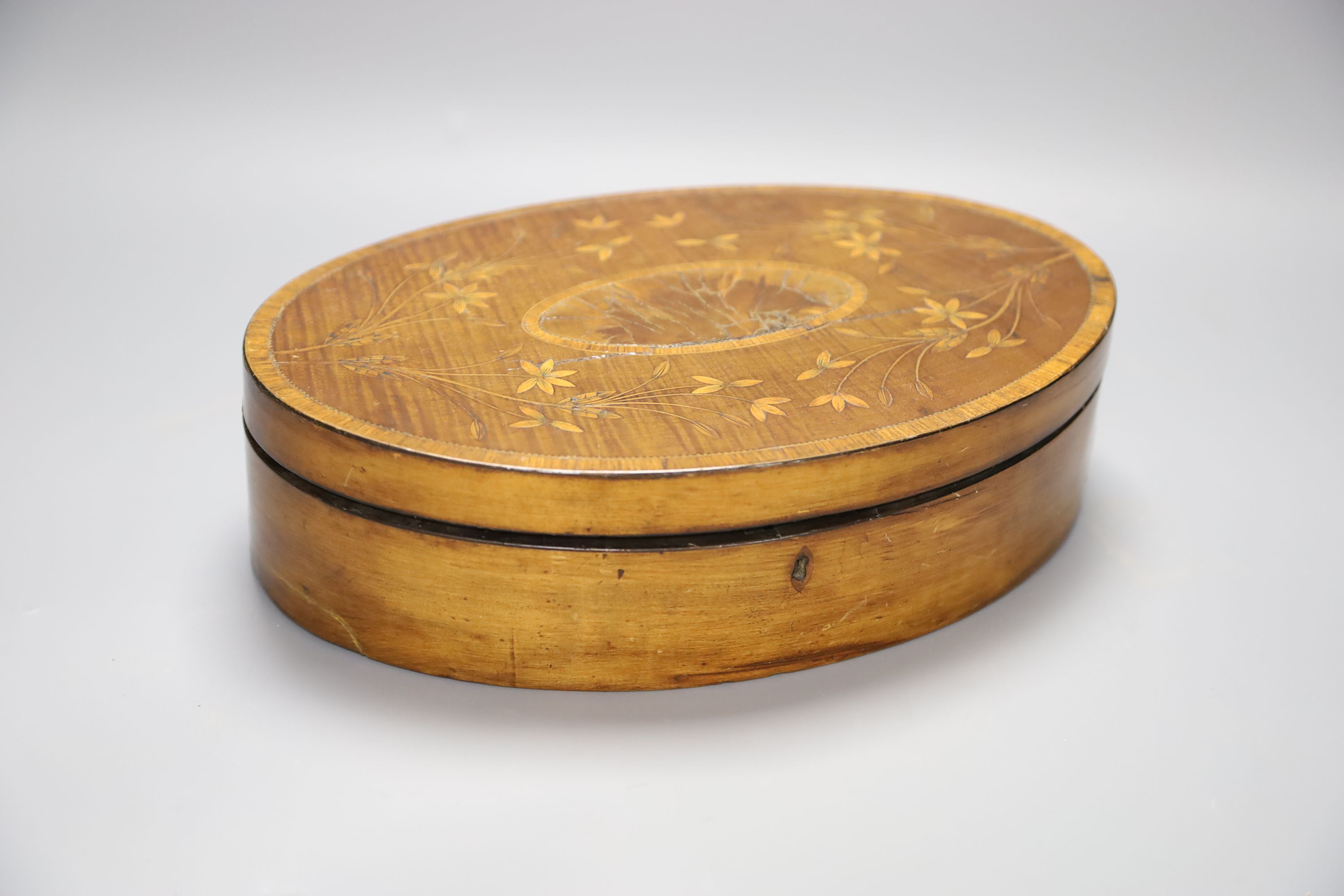 A George III oval marquetry inlaid box, length 29cm